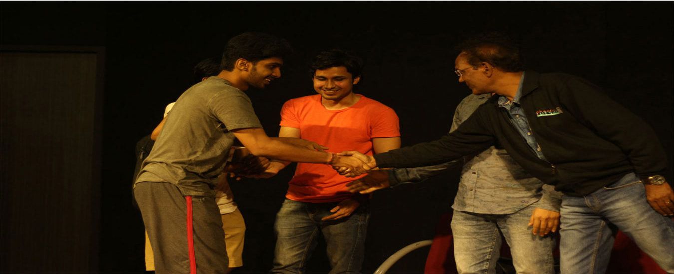 Our-student-receiving-best-actor-award